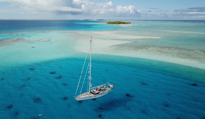 oyster yacht at anchor in remote location