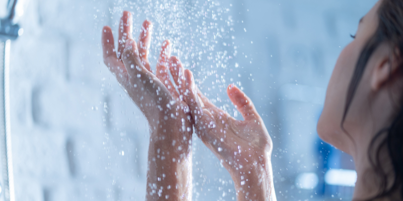 Women in shower washing